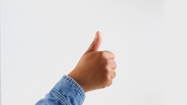 male hand on jeans shirt thumbs up, victory and ok gestures on white closeup