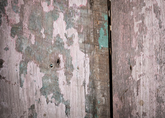 Pinks and turquoise flecks of paint and scratches with grain make a beautiful vintage background