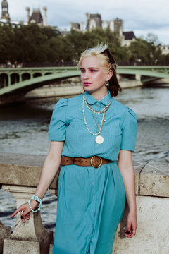 Young woman in colorful style on a bridge in Paris