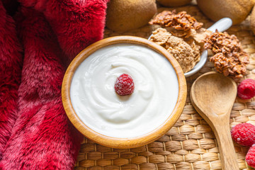 Greek yogurt in bowl with spoons,Healthy breakfast with Fresh greek yogurt, muesli and berries on background