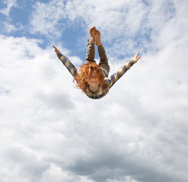 Young boy flying in the air