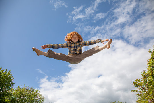 Young boy flying in the air