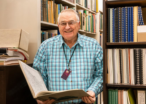Librarian in the stacks at college museum library