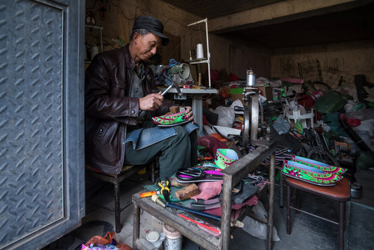A Cobbler in His Shoe Repair Shop