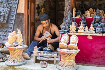 Craftsman Carving Wooden Figures in a Nepalese Village