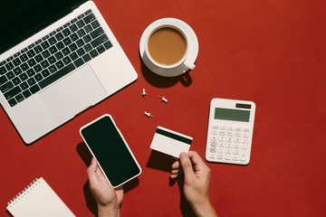 A man is doing a online shopping purchase with smartphone