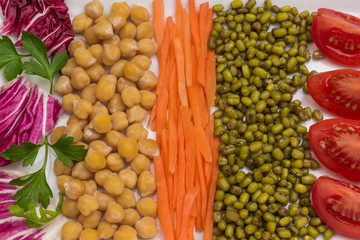 Mix of chickpea and mung bean, cabbage leaves, carrots and tomato.