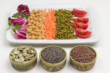 Mix of chickpea and mung bean, cabbage leaves, carrots and tomato.