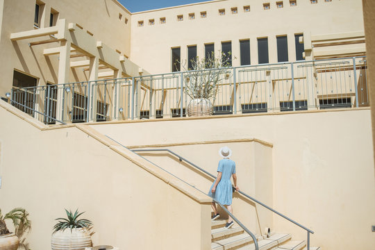 Anonymous woman walking up stairs
