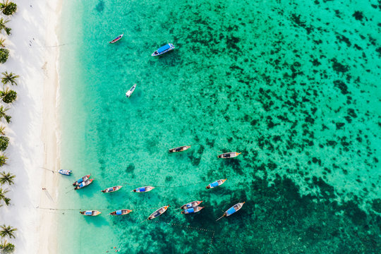 Boats moored close to the beach