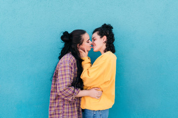 Young women kissing