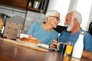 Cute senior couple have breakfast together