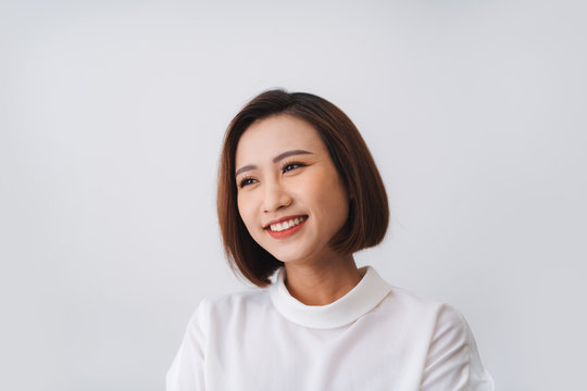 Portrait of beautiful young asian woman happiness standing on gray