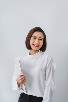 Portrait of beautiful Asian business woman holding folder