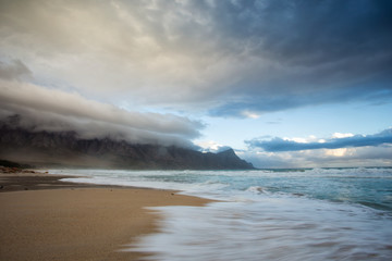 Wide angle view of a stunning sunset at Kogelbay just outside Gordonsbay in cape town south africa