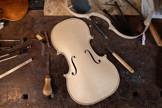 Man making a violin