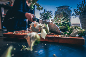 Child chopping brocoli