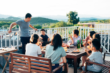 Friends barbecuing on rooftop