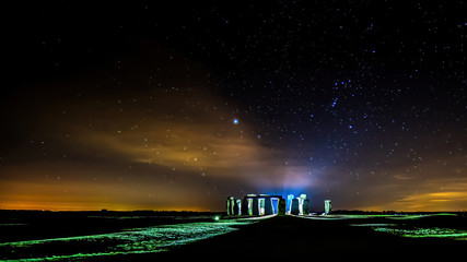 Mystic looking lights at a starry night at Stonehenge in Wiltshire, Great Britain.