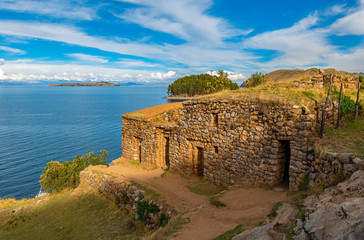 The Inca ruins of Chincana at sunset on the sun island or Isla del Sol with a view over the Titicaca Lake, Bolivia.