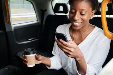 Businesswoman backseat taxi.