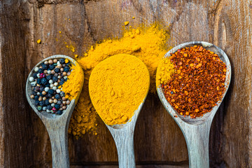 Colourful various herbs and spices for cooking on  background