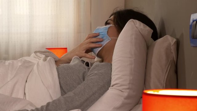Closeup of sick woman in the morning in hospital with coronavirus not able to breath with pneumonia