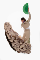 flamenco dancer in brown dress and green fan