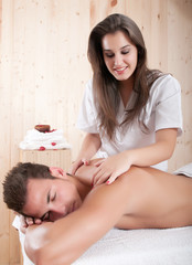 Obraz na płótnie Canvas Young man having a massage sesion
