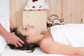 Obraz na płótnie Canvas Young woman in spa or sauna