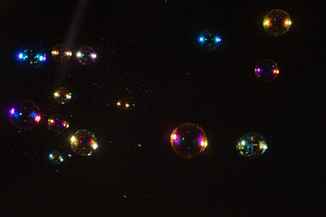 Soap bubbles isolated on a black background. Copy space.