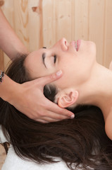 Obraz na płótnie Canvas beautiful woman having a massage in a health center