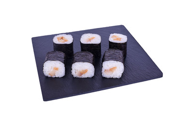 Traditional fresh japanese sushi maki on black stone Maki Escolar on a white background. Roll ingredients: escolar fish, nori, rice.