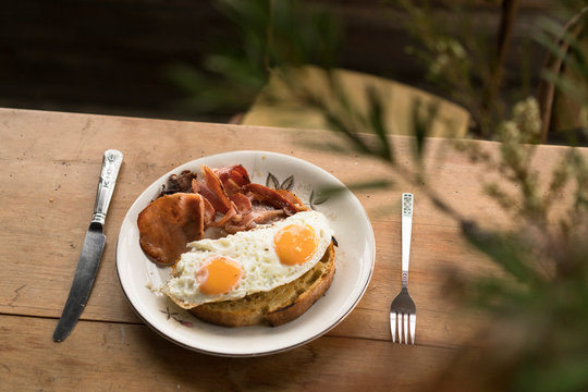 Simple bacon and eggs in a rustic cabin
