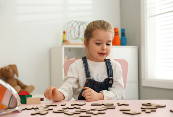 Cute little girl at speech therapist office