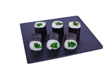 Traditional fresh japanese sushi maki on black stone Maki Hiashi on a white background. Roll ingredients: algae hiyashi, nori, rice.