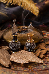 Agarwood, also called aloeswood, essential oil and incense chips