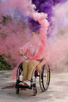 Disabled Woman With Pink And Purple Smoke Bombs