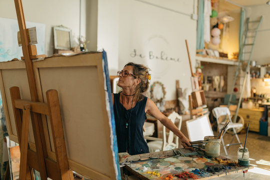 Artist woman drawing in her studio.
