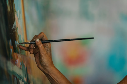 Artist woman drawing in her studio.