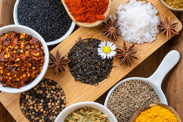 Colourful various herbs and spices for cooking on  background