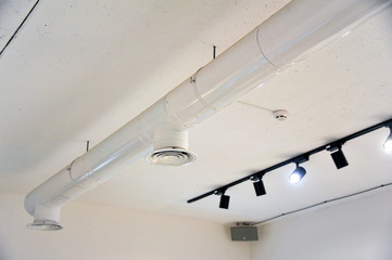 Modern style ceiling. Elements of the interior. Lamps on the ceiling