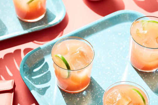 Glasses with refreshing mocktails on blue tray