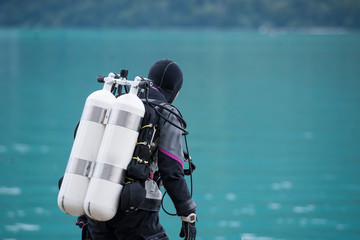 scuba diver ready to enter the water