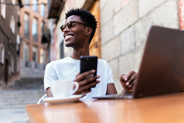 African man using mobile phone