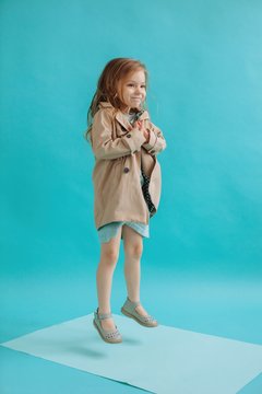 Jumping little girl portrait