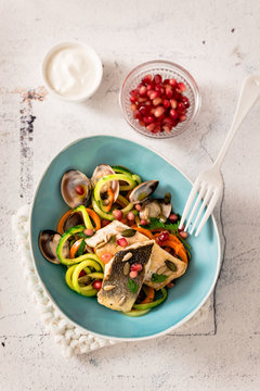 Vegetable spaghetti with clams and sauteed fillet of sea bream