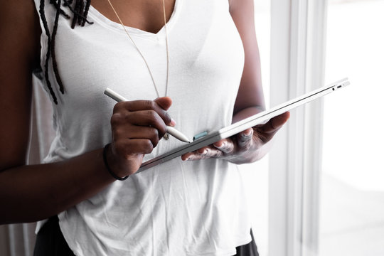 Woman drawing on a device