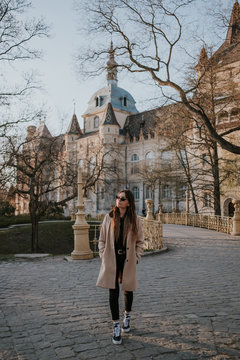 Portrait of woman in the gardens of a castle