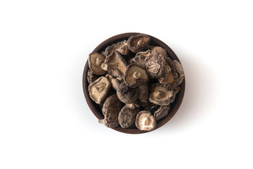 Dried Shitake Mushroom   into a wooden bowl